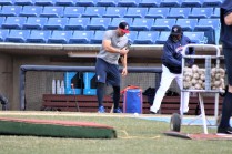 Lamar Johnson, roving instructor for the Mets, works with Tebow on being "quick" to the ball.