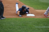 Tebow finishes his slide.